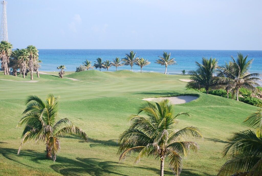 Tee off amidst stunning scenery at Jamaica's premier golf courses, a relaxing addition to your Jamaican excursions.